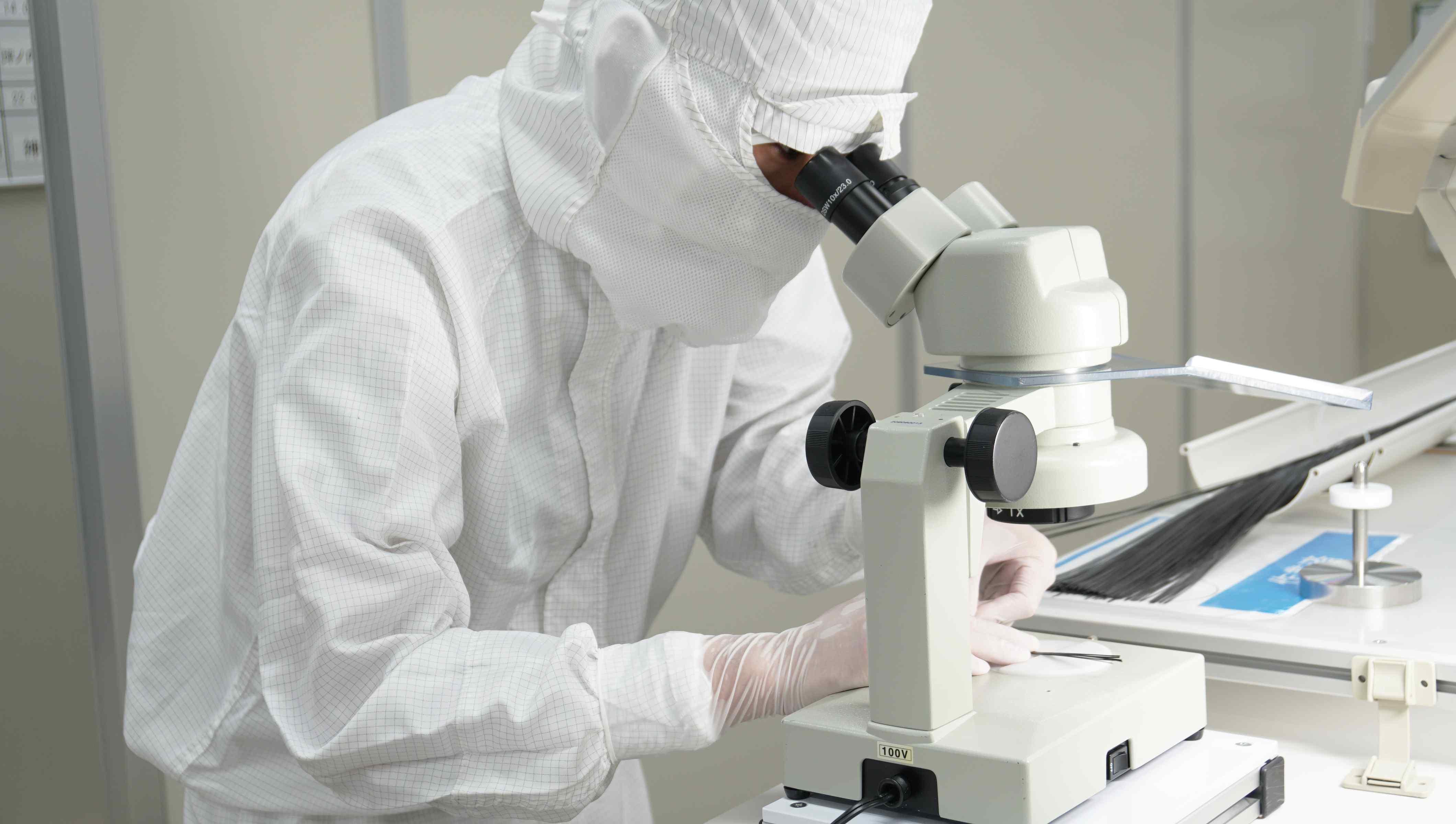 Engineering professional working on precision equipment